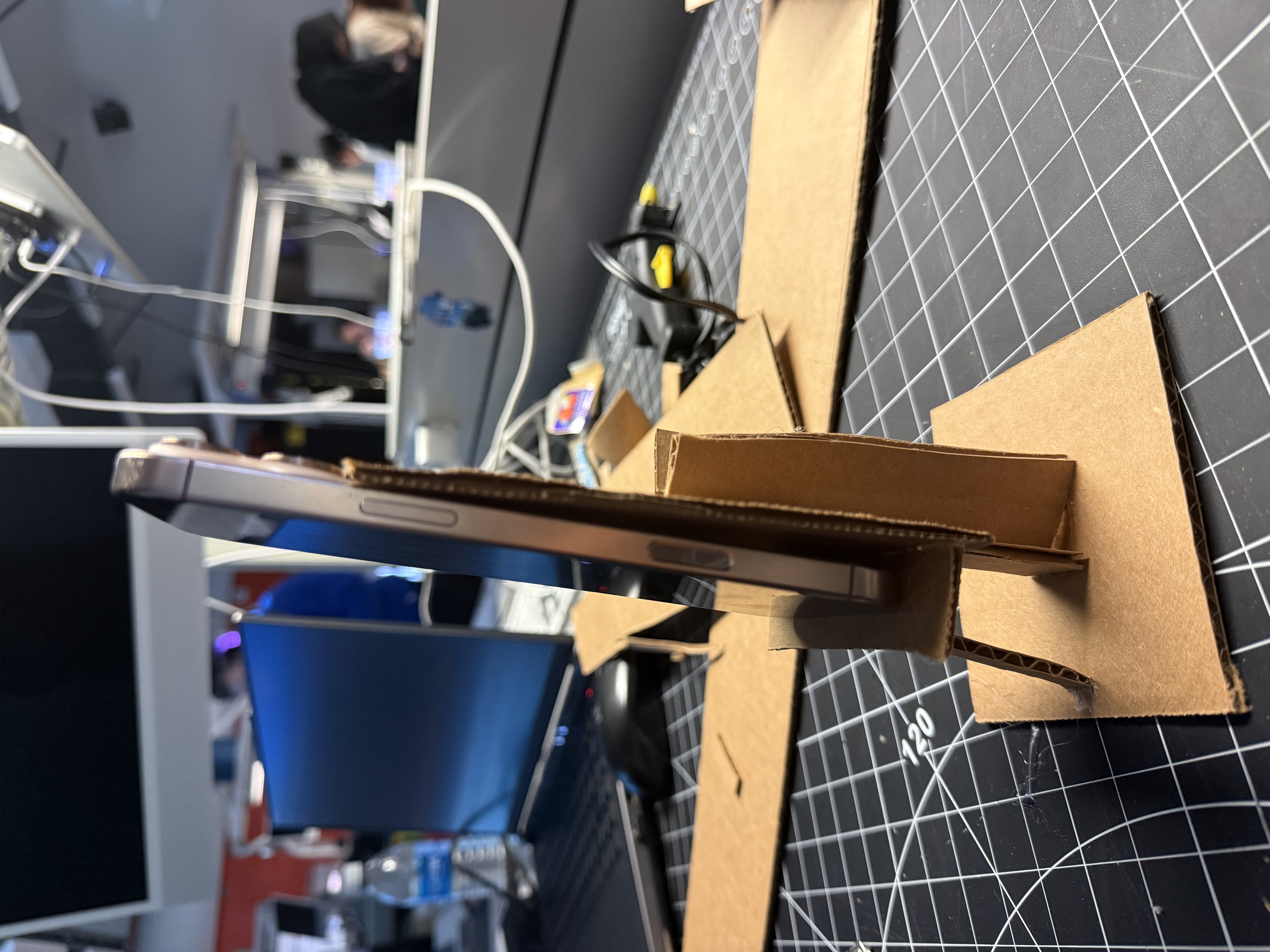 I reinforced the vertical form and evaluated how well the cardboard could support weight in a slim profile.
